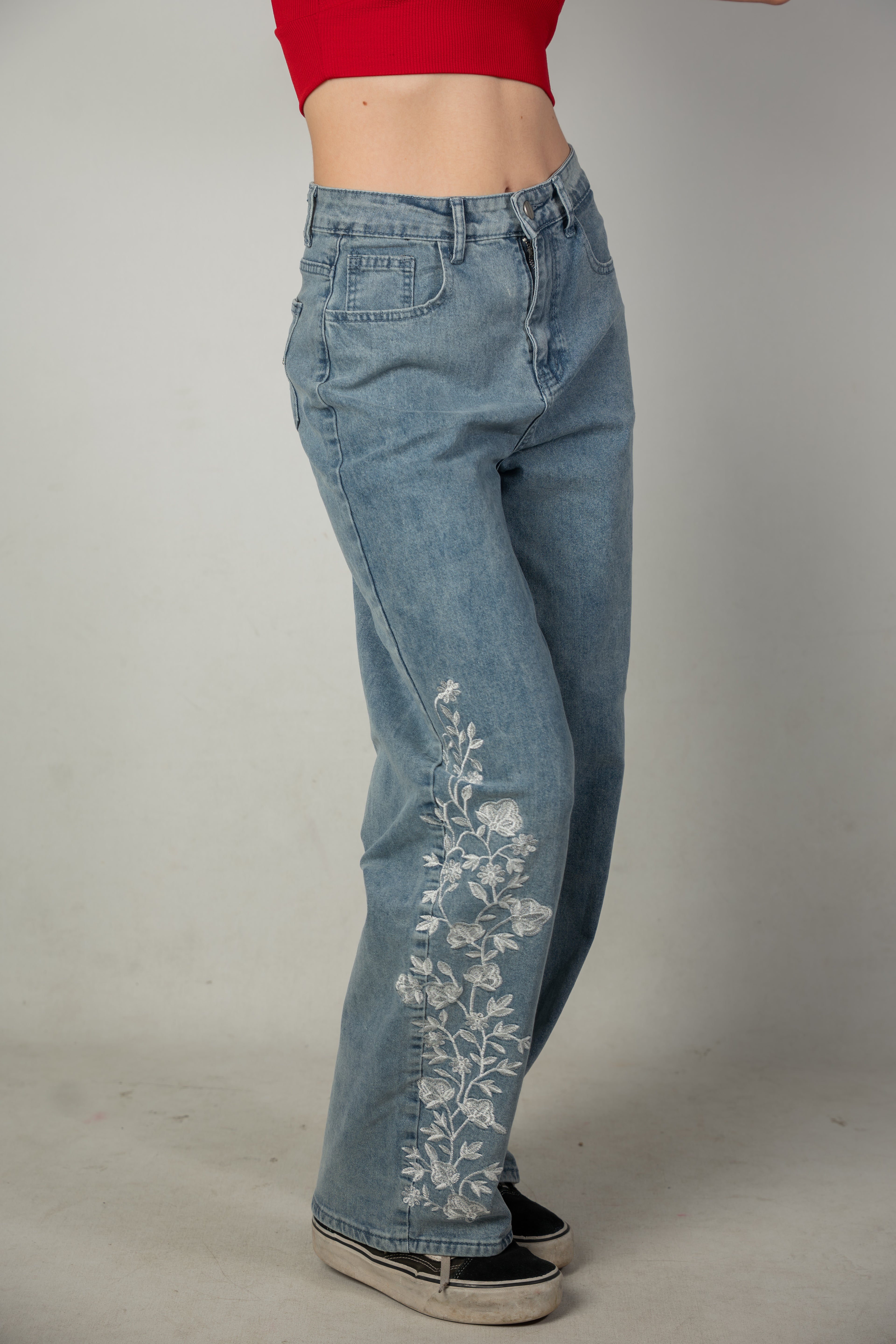 Embroidered light-wash blue jeans