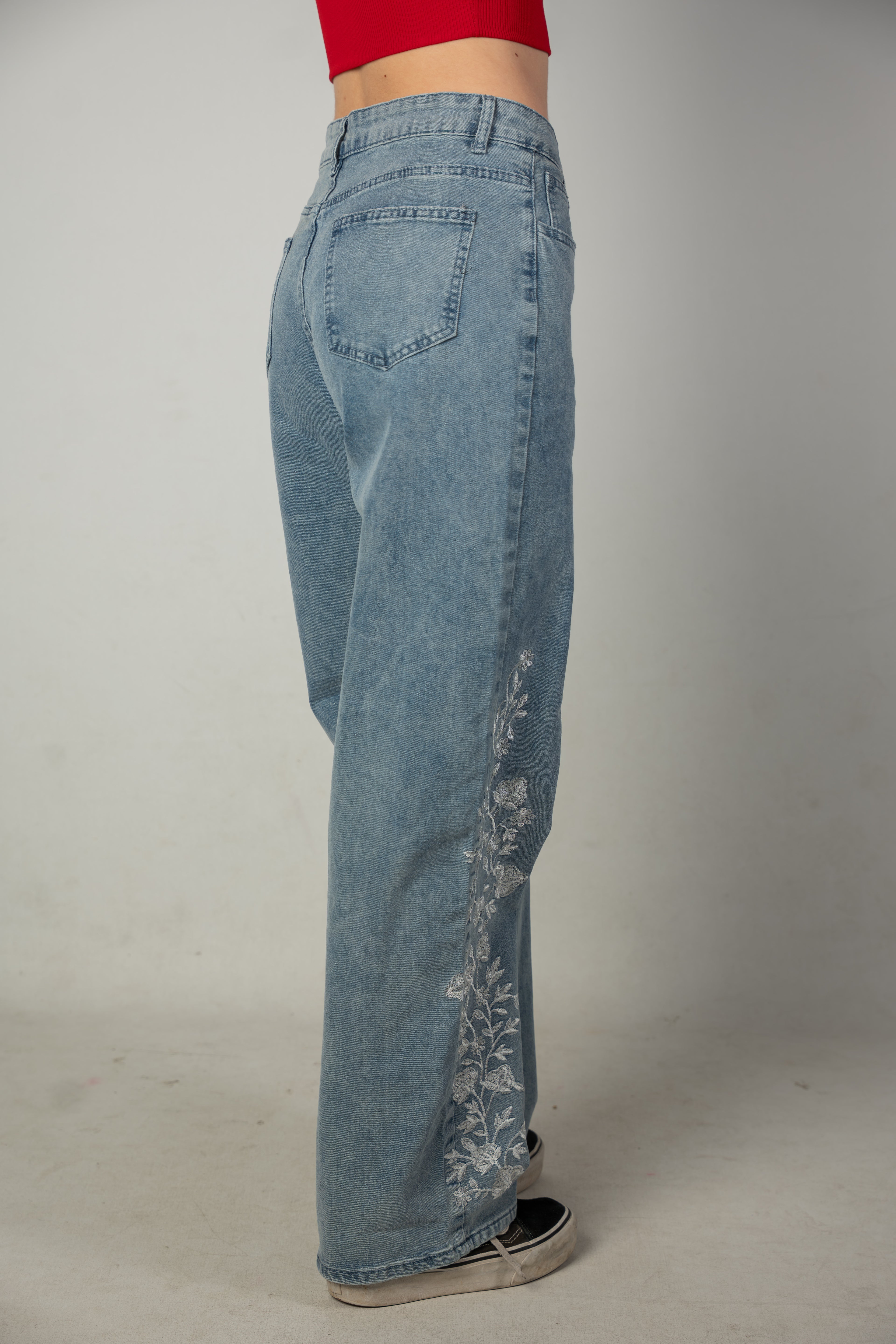 Embroidered light-wash blue jeans