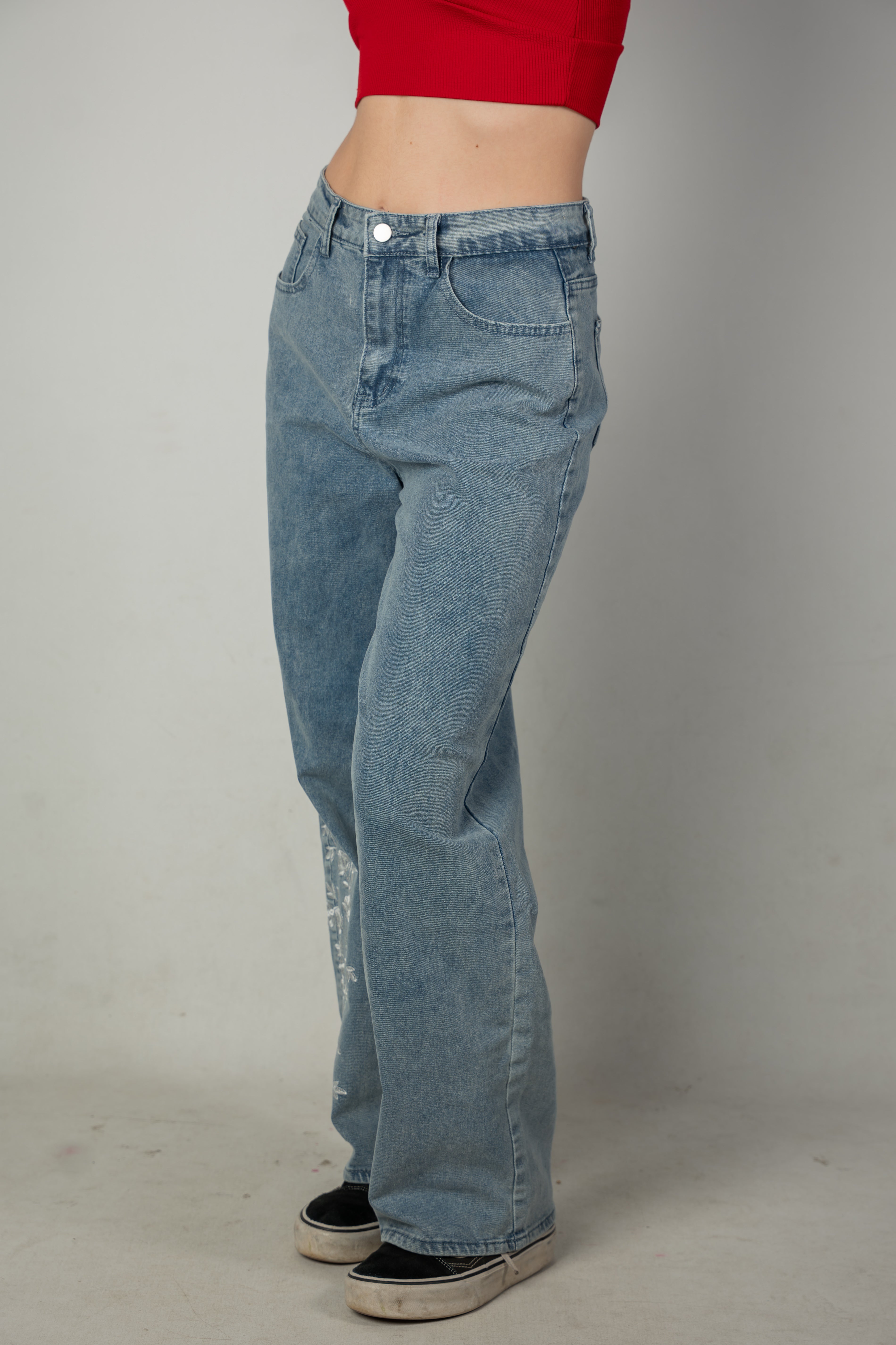Embroidered light-wash blue jeans
